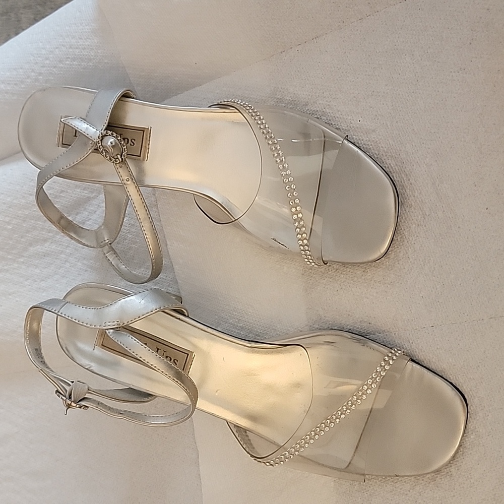 Clear with rhinestones, clear 2 1/2 in. heels.  9W but fits a little narrow .